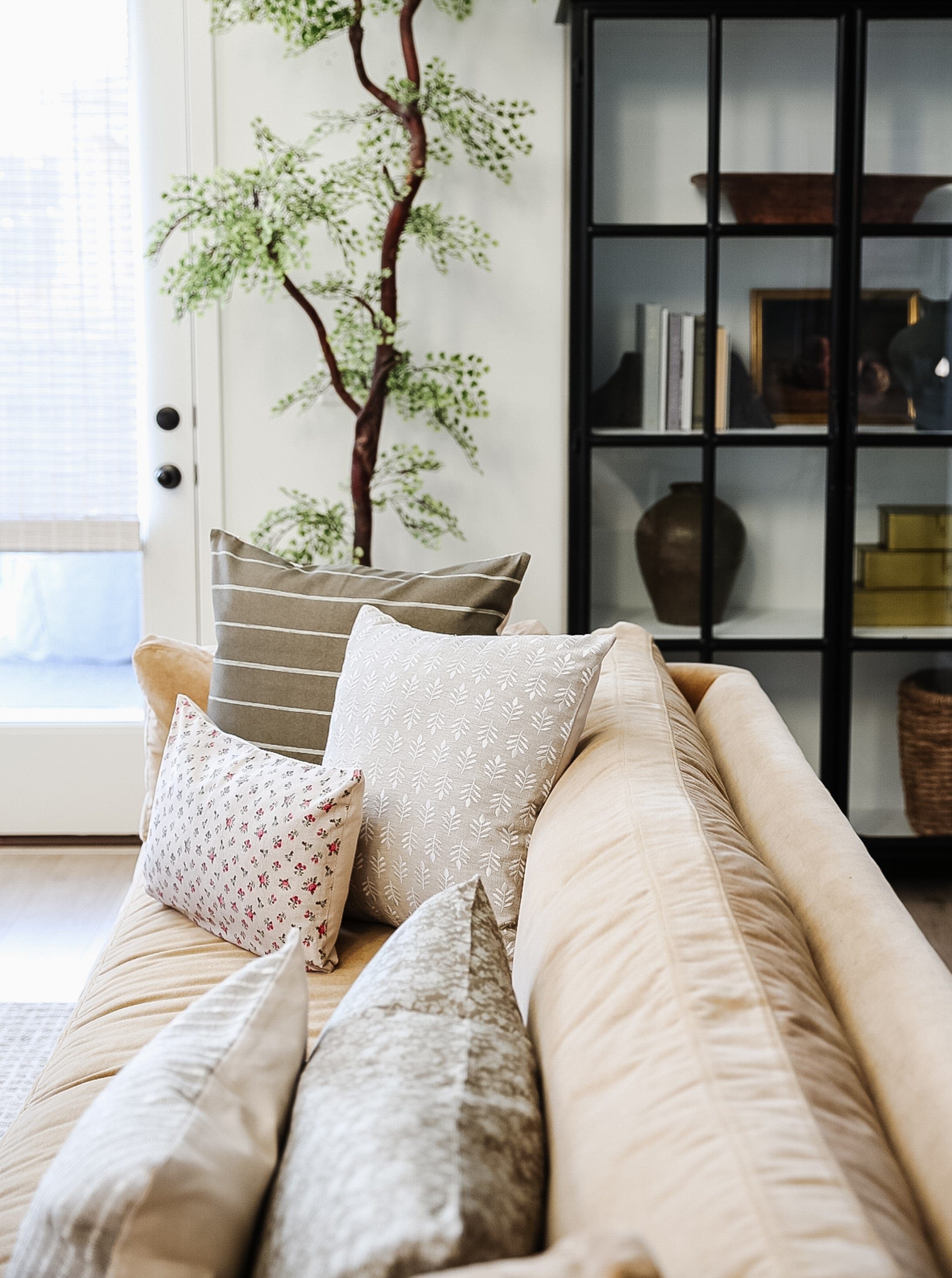 brown striped pillow on sofa