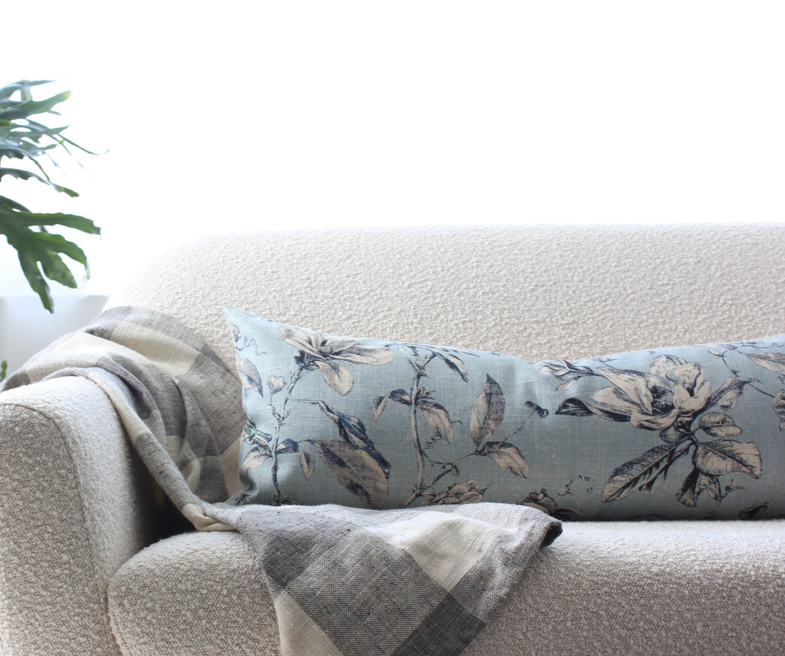light blue long lumbar pillow cover on sofa