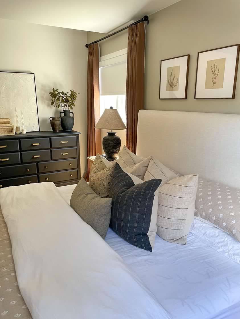 neutral throw pillows on bed