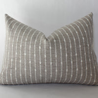 beige textured lumbar throw pillow