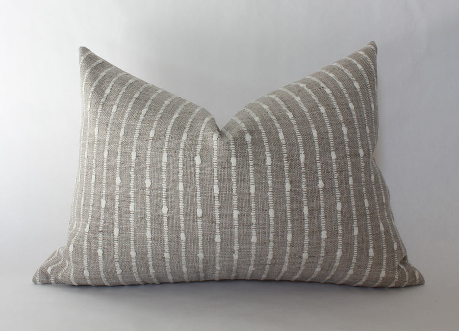 beige textured lumbar throw pillow