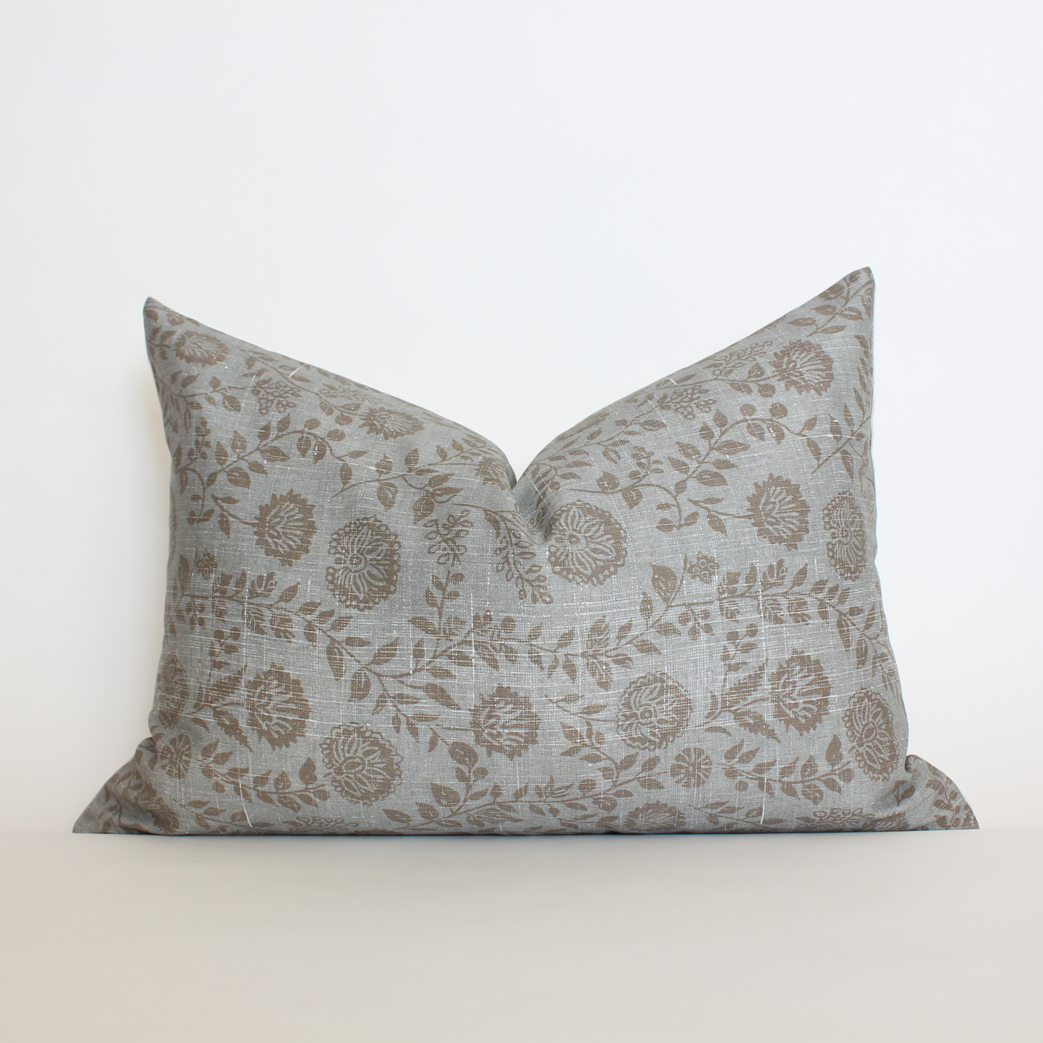 Blue gray floral lumbar throw pillow cover with scattered botanical vine detail, coastal home decor