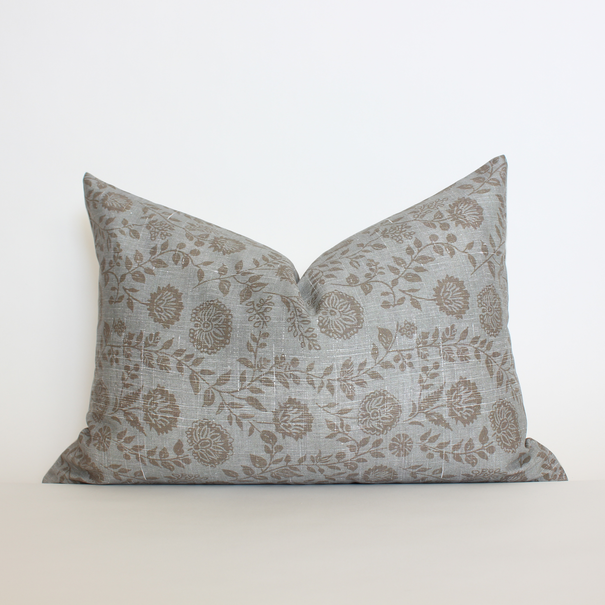Blue gray floral lumbar throw pillow cover with scattered botanical vine detail, coastal home decor