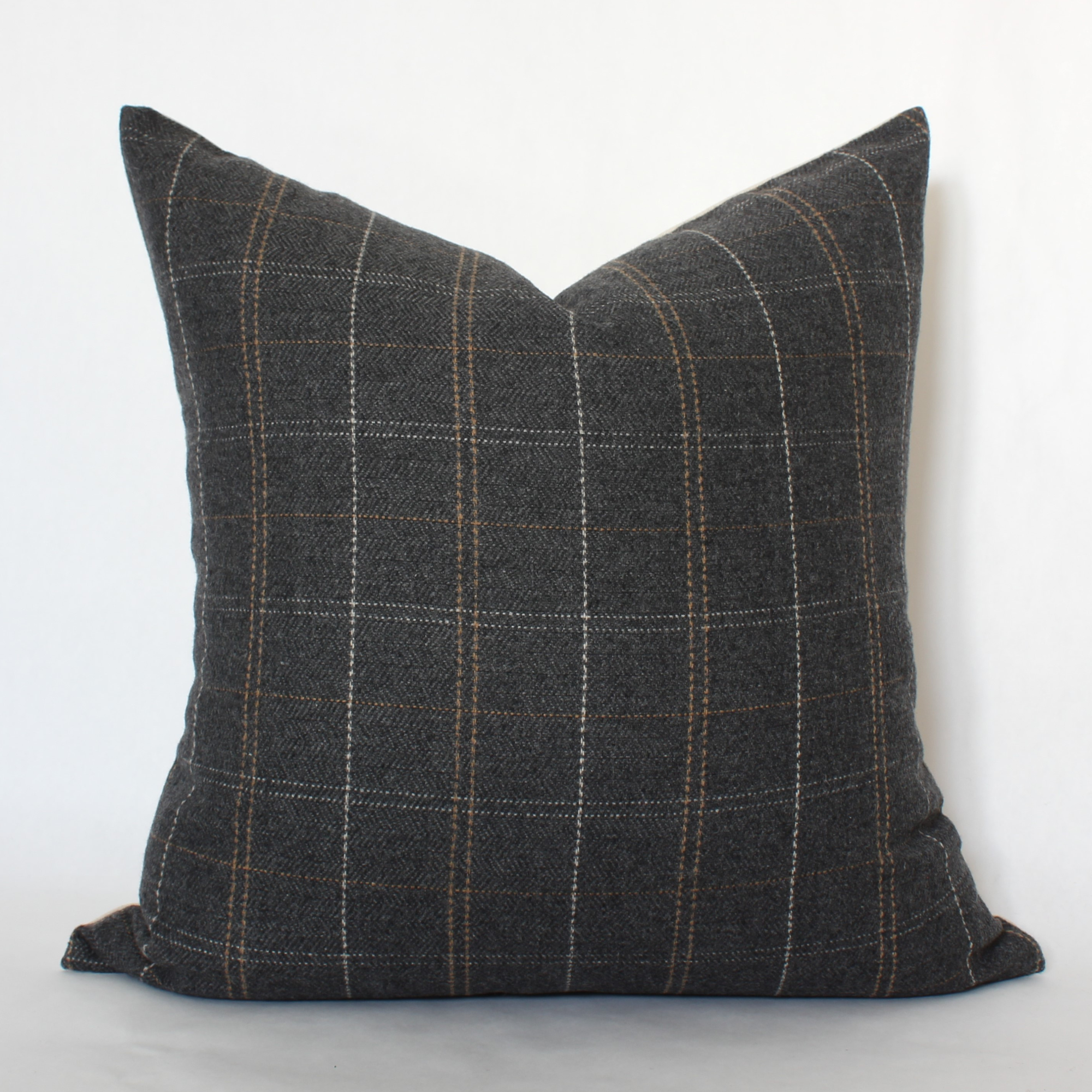 Gray checkered pillow on a white background