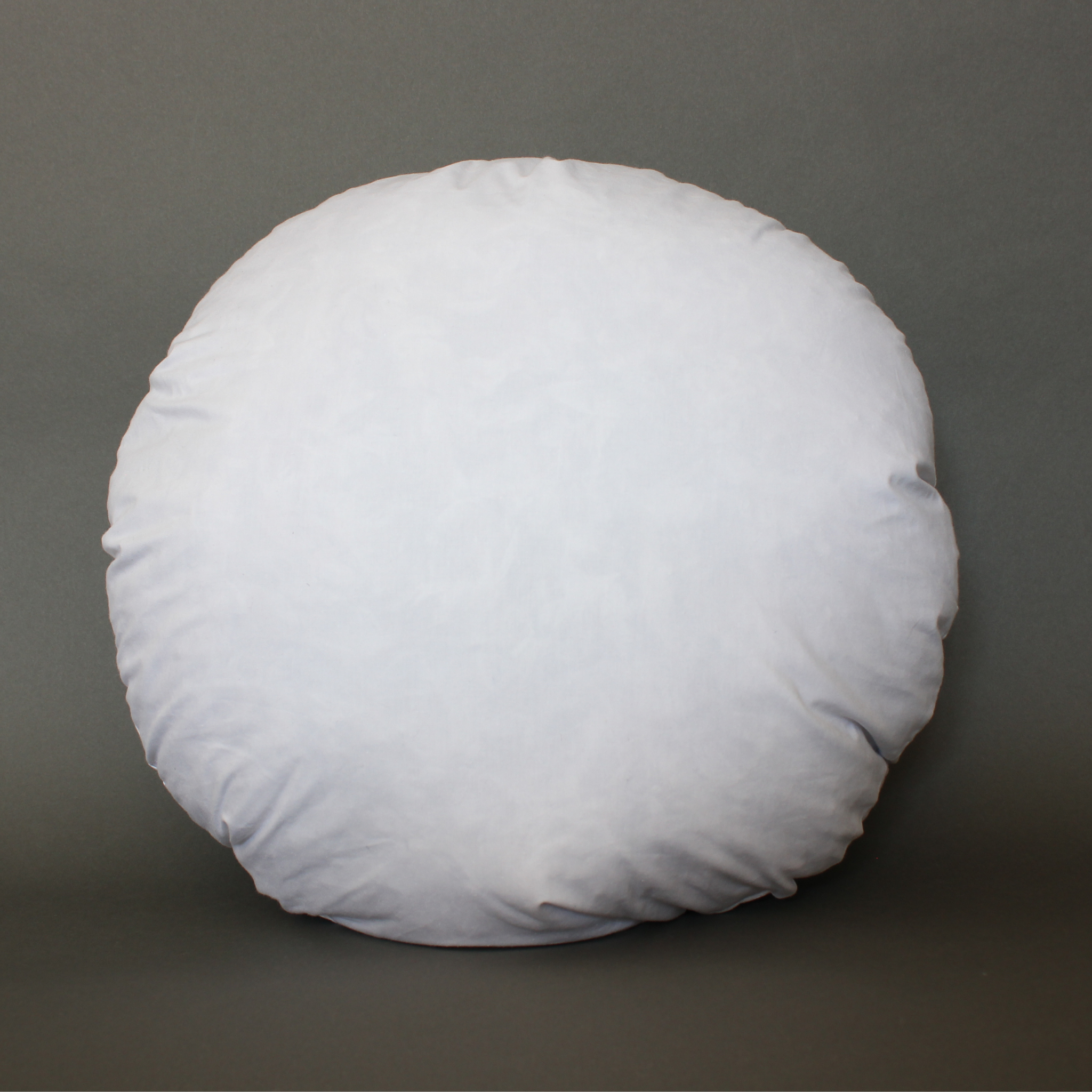 Round pillow form with 100% cotton cover, front view showing full circular shape