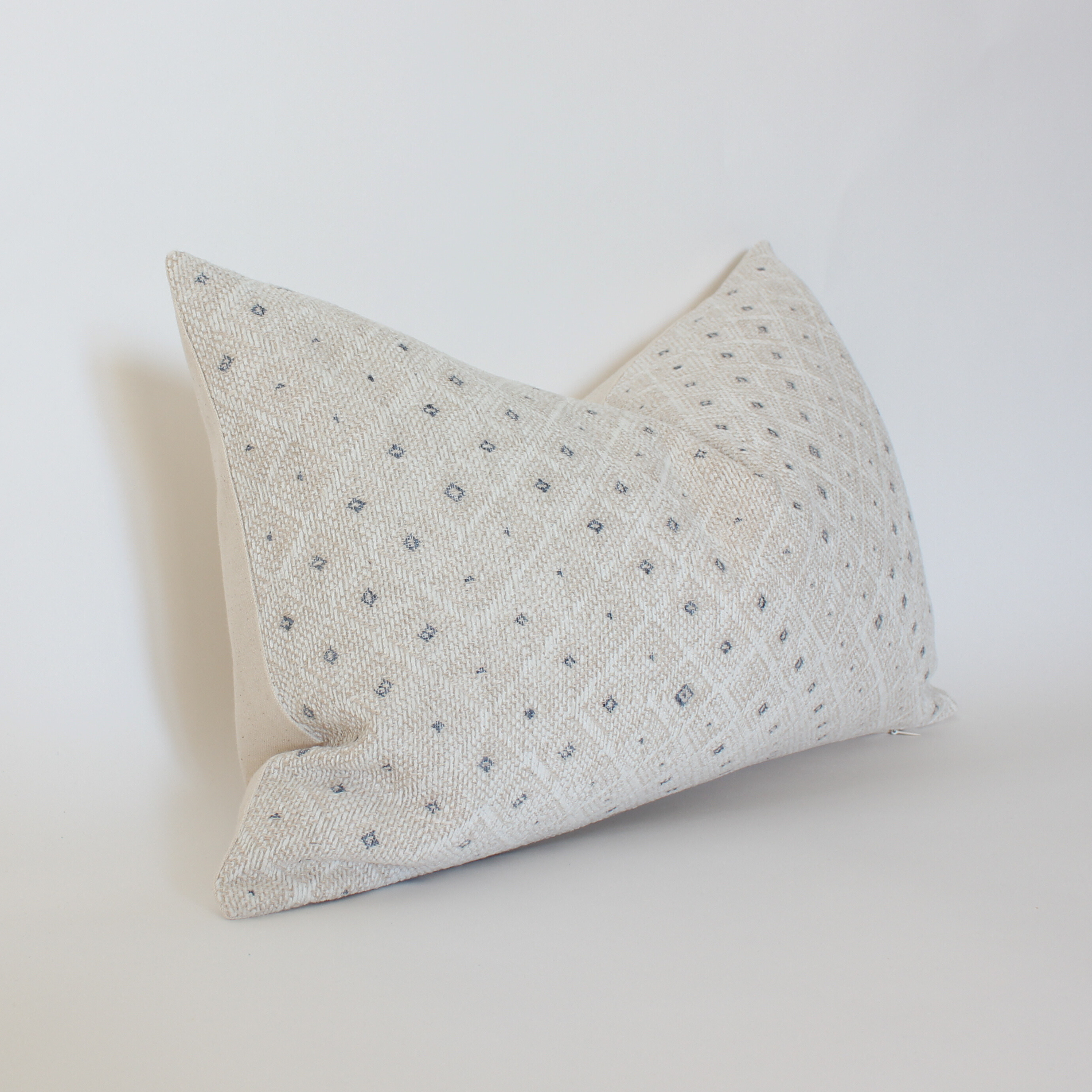 cream blue speckled lumbar pillow