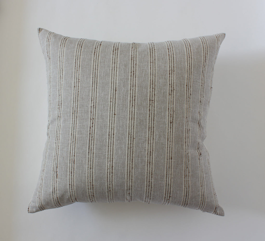 cream striped throw pillow couch