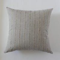 cream striped throw pillow couch