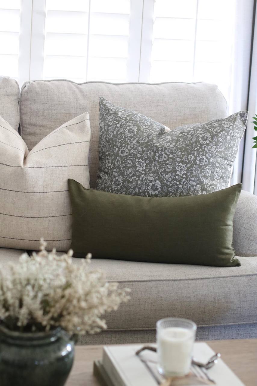 olive green lumbar pillow on sofa