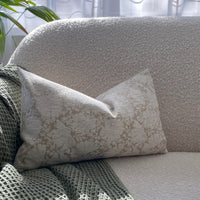 white and brown pillow cover on sofa