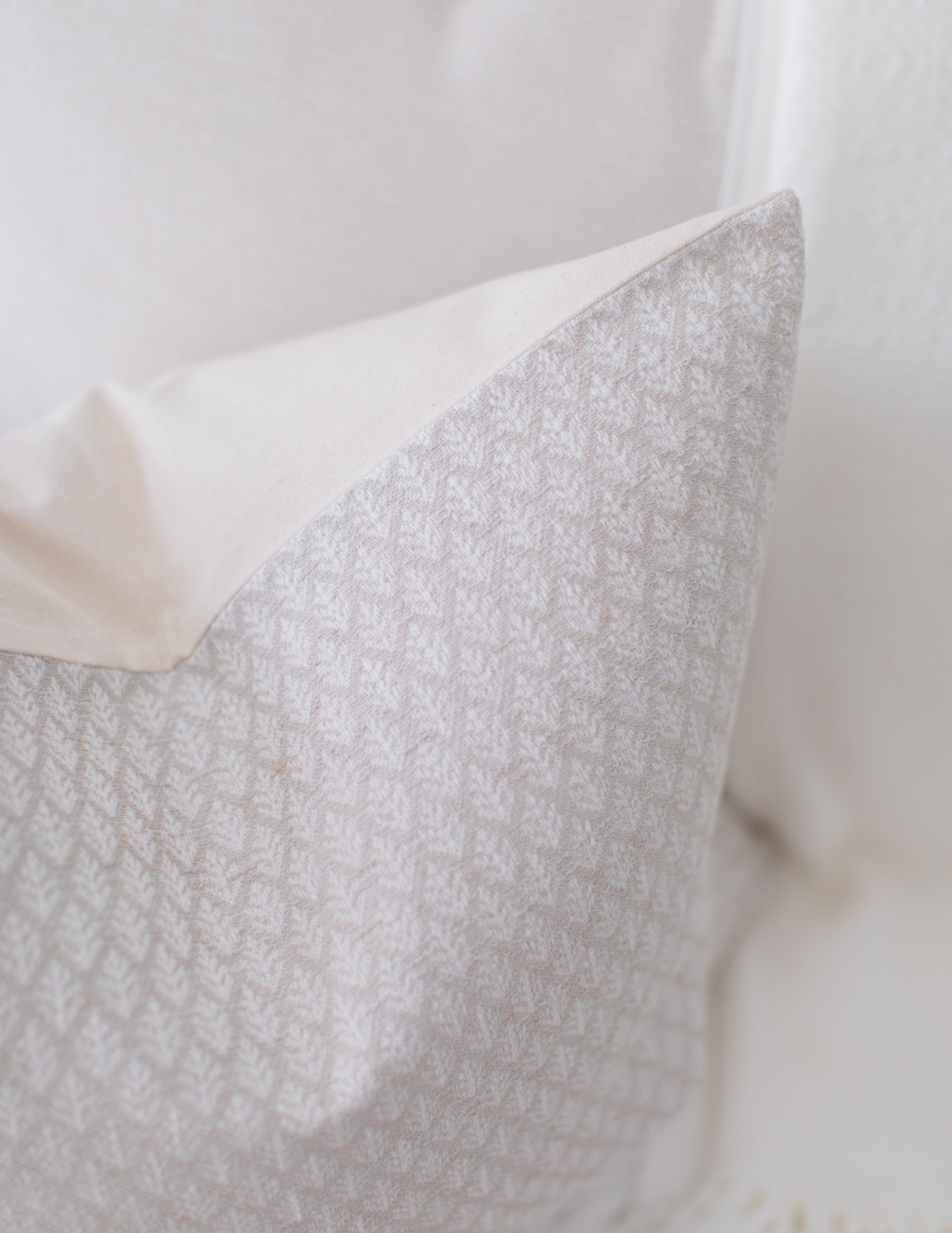 light tan floral pillow