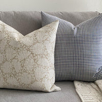 neutral floral and blue pillow 
