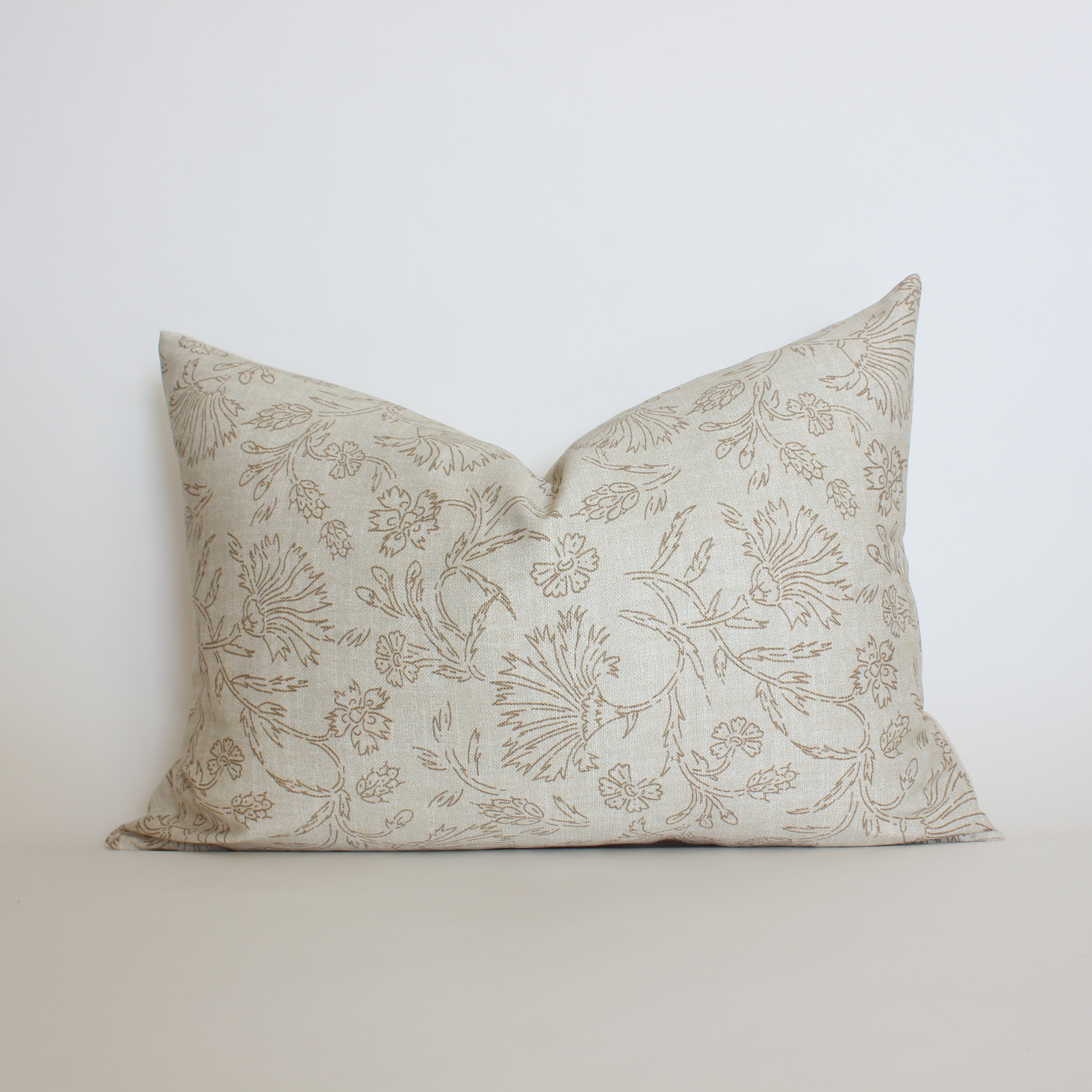 Warm neutral botanical lumbar pillow cover with taupe vine and floral print, coastal home decor