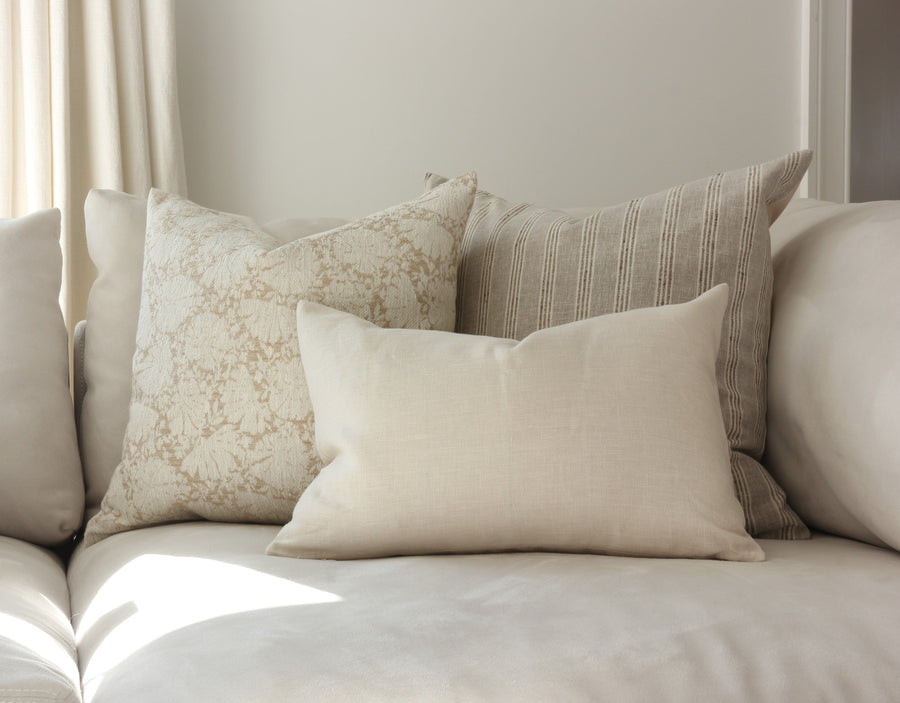 neutral throw pillows on sofa