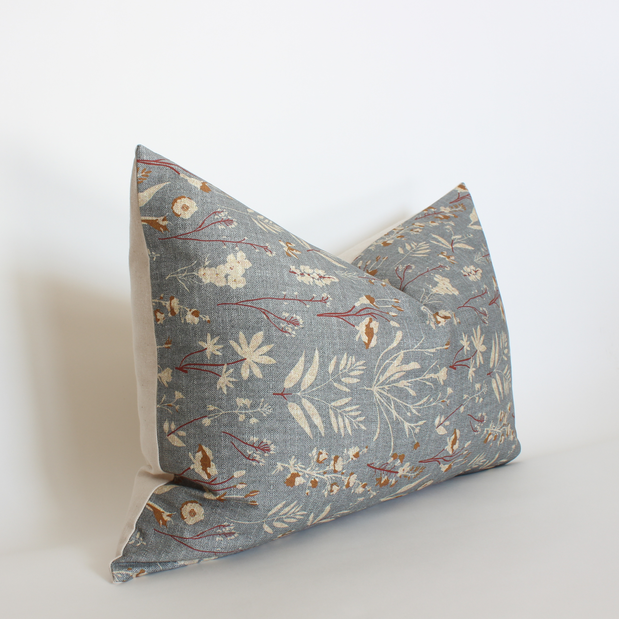 Floral-patterned pillow on a white background
