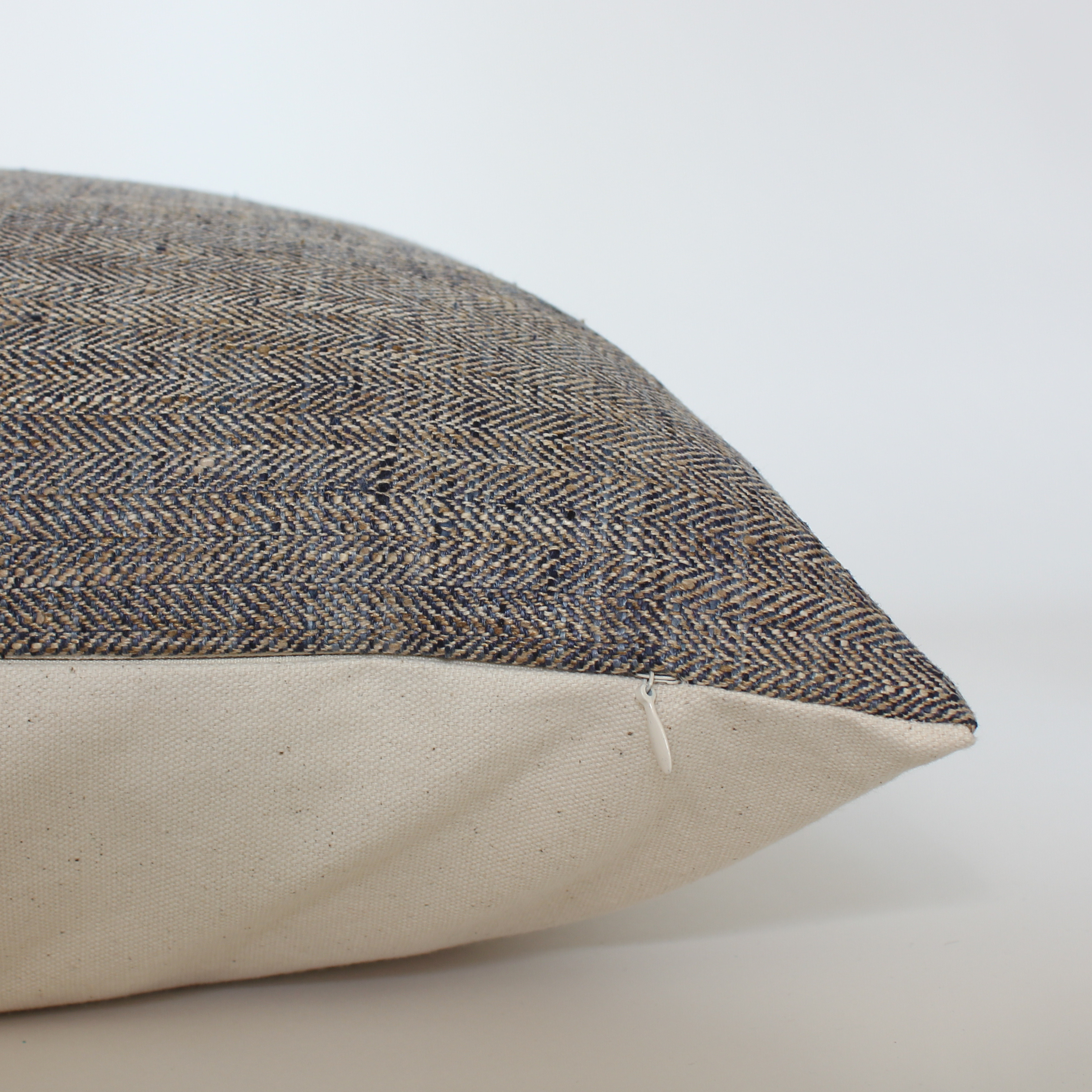 woven solid brown and blue accent pillow