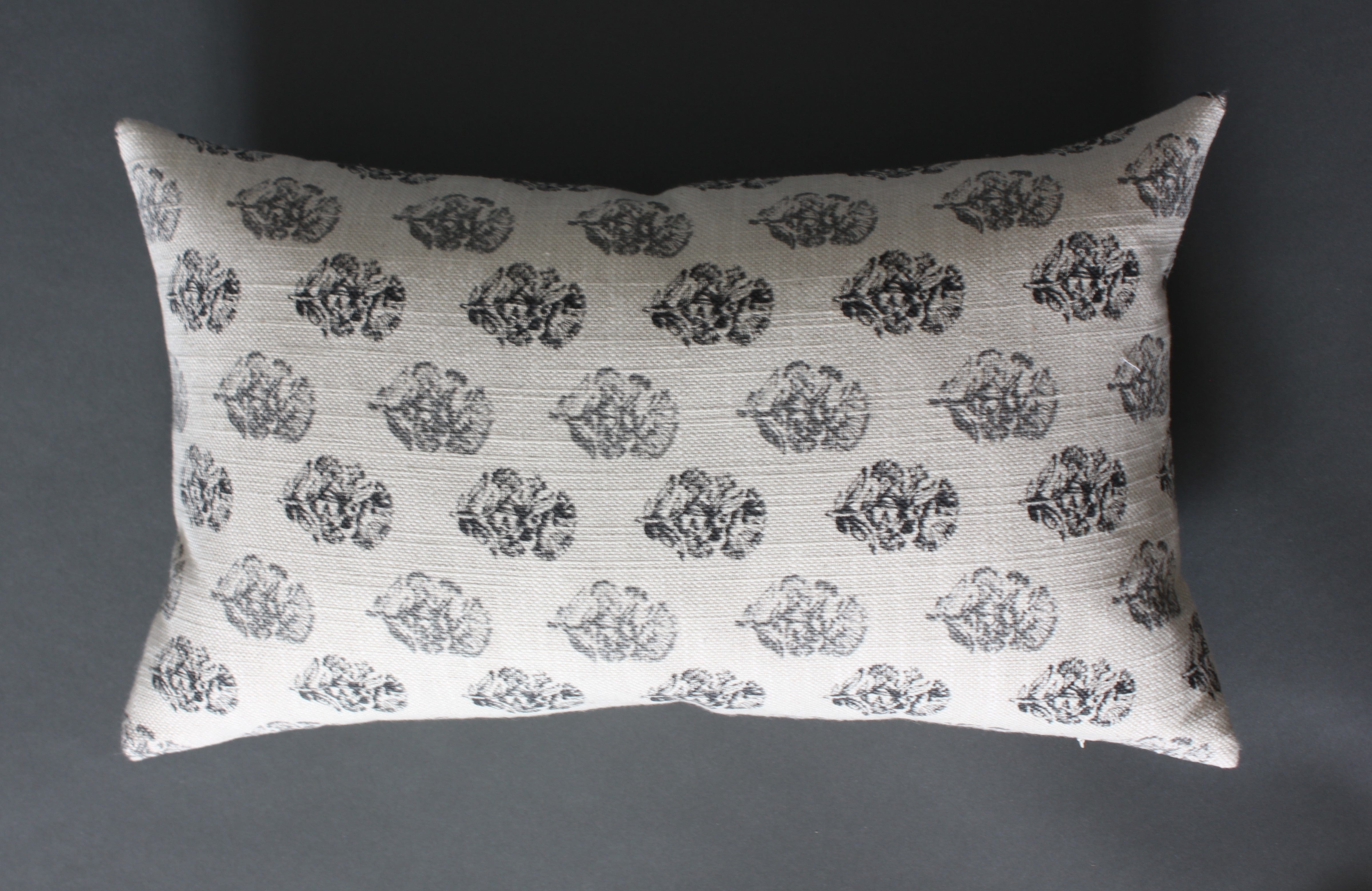 off white and gray lumbar pillow