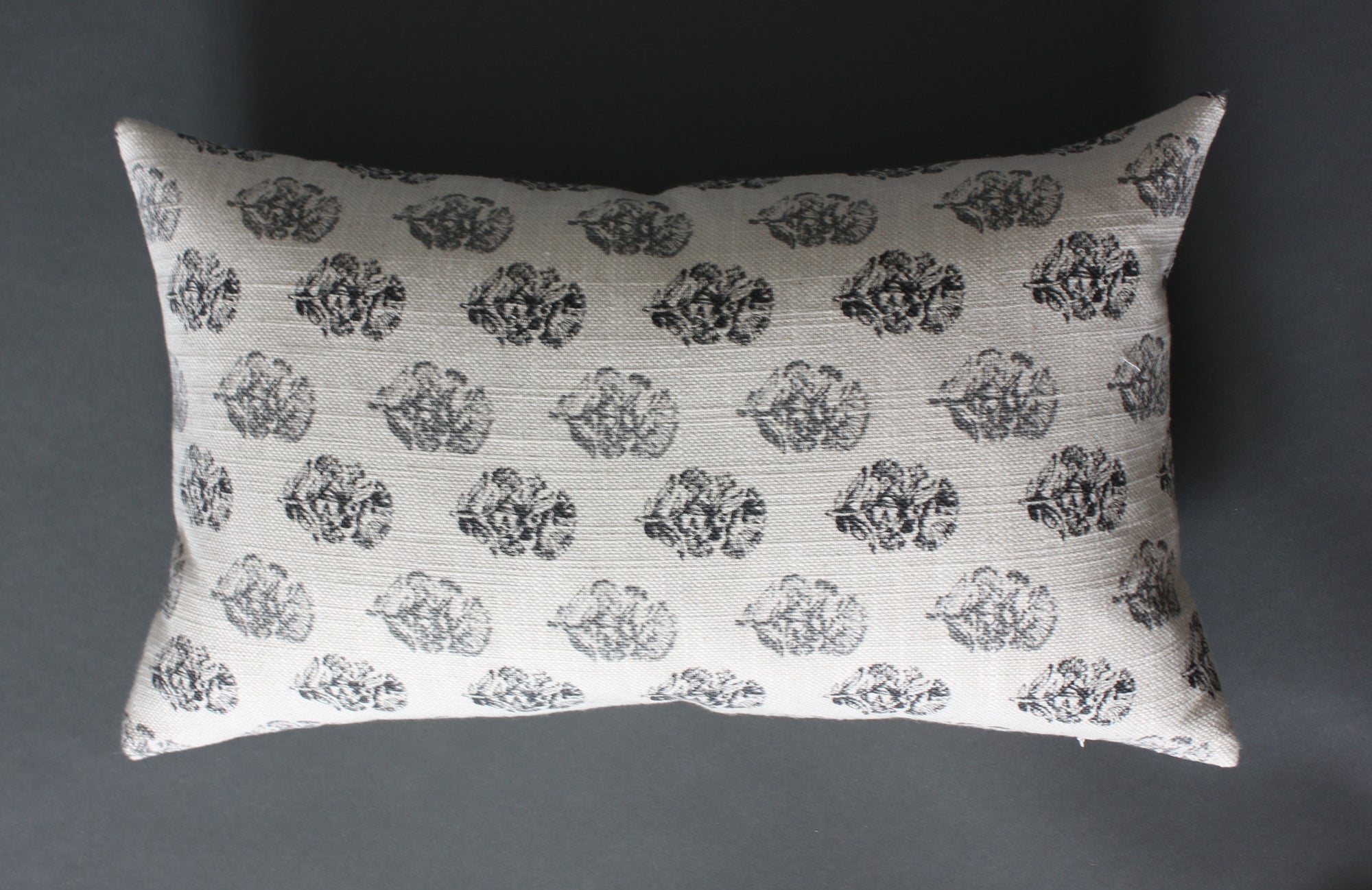 off white and gray lumbar pillow